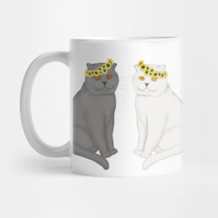 Two cats in the wreaths on the head from sunflowers. Grey and white cats. Mug